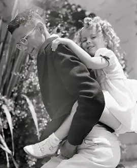 Shirley Temple Getting a Piggy-Back Ride
