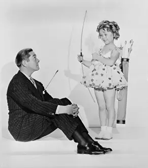 Shirley Temple Holding Bow With Jimmy Dunn