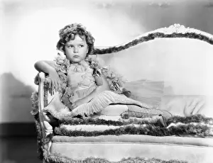 Shirley Temple Sitting On A Couch