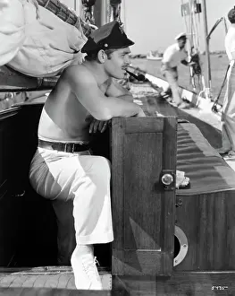 Timeless charm - Legendary style.: Shirtless Clark Gable Smoking Pipe on Ship