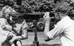 Prints of 27th July 1946: Family playing with a telescope at Bisley. Original Publication: Picture Post - 4143 - Bisley In The Atom Age - pub A Glimpse into the Past: Shooting At Bisley