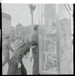 Shoppers Admiring a Window Display