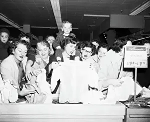 Counter Prints: Shoppers at Counter of Department Store