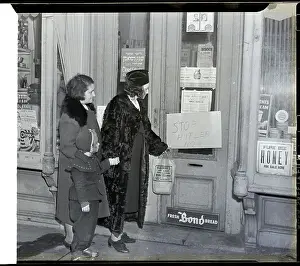 Shoppers Look At Sign On Door