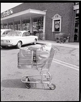 Groceries Prints: Shopping Cart In Grocery Parking Lot