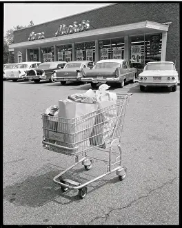 Groceries Prints: Shopping Cart in Parking Lot