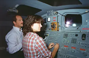 Instrument Panel Prints: Shuttle Astronauts Practicing with Robot Arm
