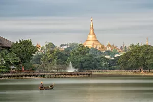 Images Dated 16th December 2016: Shwedagon Pagoda in the morning view at wooden boardwalk at the Kandawgyi Lake in Yangon, Myanmar