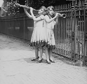Siamese Sisters Playing Instruments