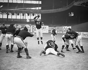Passing Prints: Sid Luckman Jumping in Air to Pass Ball