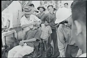 Hanoi Prints: Sidewalk Dentist Tending to Patient
