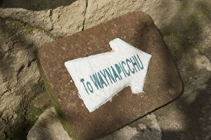 Images Dated 27th April 2011: a sign on a rock pointing to the mountain wayna picchu