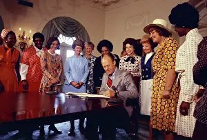 Prints of American politician US President Gerald Ford (1913 - 2006) signs legislation declaring August 26th Women's Equality Day, Washington DC, August 22, 1974 Unbought and Unbossed: The Trailblazing Legacy of Shirley Chisholm: Signing Women's Equality Day Legislation