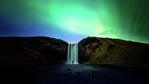 Northern Lights: A Dance of Colours Collection: silhouette women and Skogafoss waterfall with Northern Light or Aurora Borealis