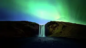 Prints of Northern Lights (Aurora borealis) Northern Lights: A Dance Of Colours Prints: silhouette women and Skogafoss waterfall with Northern Light or Aurora Borealis