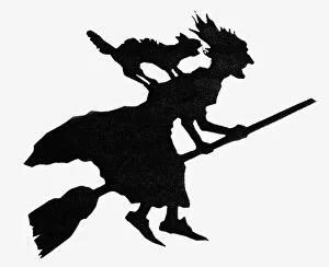 Mythology Gallery: Sillouette of a witch riding on a broomstick with black cat on her back