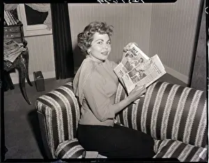 Simone Silva with Newspaper Photographs of Robert Mitchum