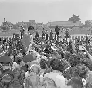 Autographing Prints: Singer and Actor Frank Sinatra with Fans