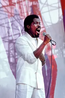 Iconic Concert Prints: Celebrate the Unforgettable Music Event That United the World: Singer Billy Ocean Performing