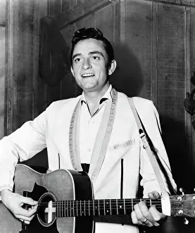 Singer Johnny Cash Playing Guitar on Television Special