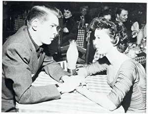 Singer Johnny Ray and Marilyn Morrison Holding Hands While Sitting at Table