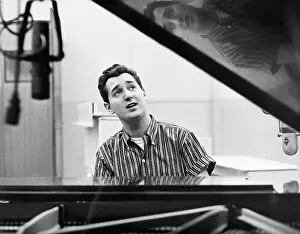 Singer Neil Sedaka Seated at a Piano