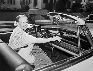 Radio Prints: Singer Peggy Lee Listening to Radio in Convertible