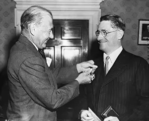 Receiving Prints: Sir Howard Florey Receiving Medal
