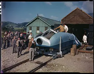 Sir Malcolm Campbell Posing Next to His Boat
