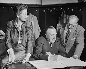 Sir William Walton Speaking with Colleagues