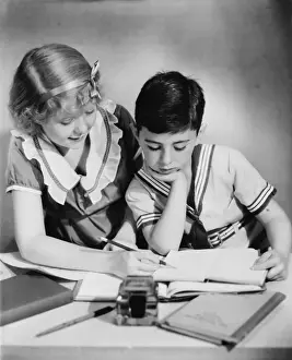 Headband Prints: Sister (12-13) helping brother (8-9) with homework, (B&W)