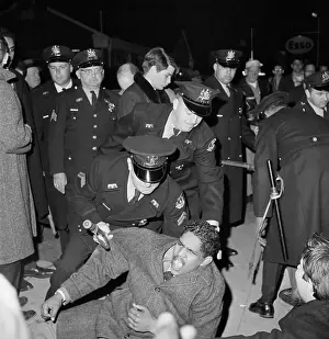 Oppression Prints: Sit-In Protester Arrested by Police Officers