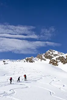 Ski hiker during the ascent of Staudenberg Joechl ridge in Ridnaun above Schneeberg, Sterzing, Staudenberg Joechl at back, South Tyrol, Italy, Europe