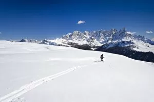 Images Dated 19th February 2011: Ski tourer descending Mt Cima Bocche, above Passo Valles, Pala group in the back, Dolomites