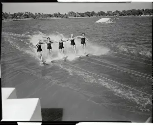 Skilled Female Water Skiers Performing on the Water