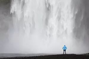Images Dated 8th June 2011: Skogafoss waterfall with a hiker, Skogar, South Iceland, Iceland, Europe
