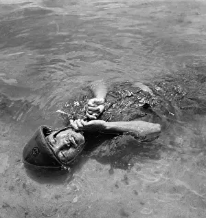 Slain Soldier Floating in Water