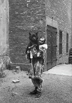 Parka Prints: Sledder Holding His Famous Dog Balto