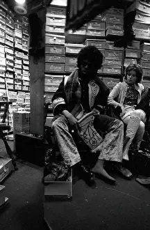 Sly Stone Tries On Boots