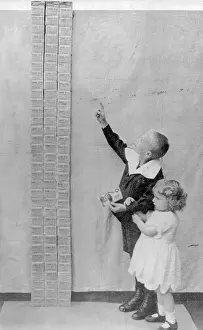 Economics Prints: Small Boy and Girl Gazing up at Pile of Marks