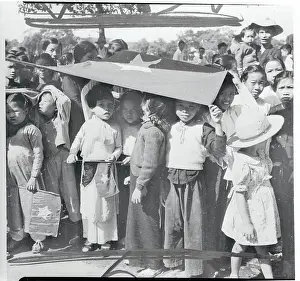 Indochina Prints: Small Children Holding Flag Over Their Heads