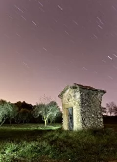 Small country house one night with stars