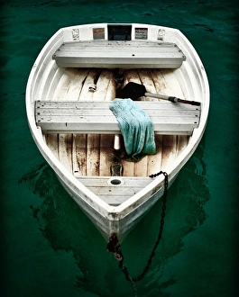 Turquoise Colored Collection: Small Fishing Boat Drifting of a Pier in Grand Case