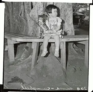 Honolulu Prints: Small Girl Sitting on Bench with Doll