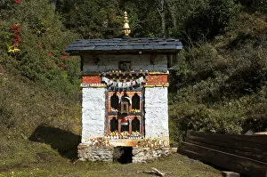 Small shelter for a Buddhist prayer wheel at the entrance to Dochula Pass, Bhutan, South Asia