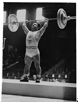 Strong Prints: Small Weight Lifter Joe De Pietro Lifting Weights