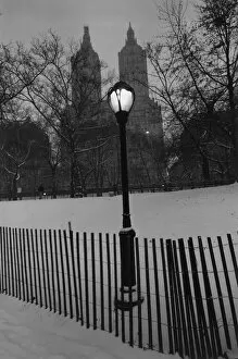 Trees Gallery: Small wooden fence and a lamppost in a snowy park