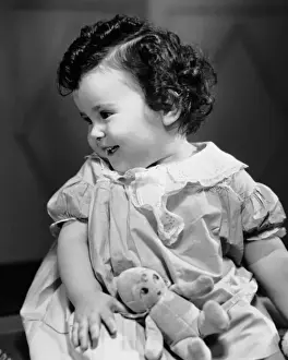 Smiling baby w / teddy bear