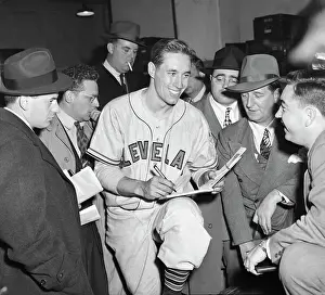 Autographing Prints: Smiling Bob Feller Signing Autographs