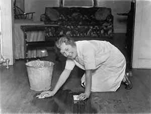Washing Prints: Smiling Housewife Scrubbing Floor